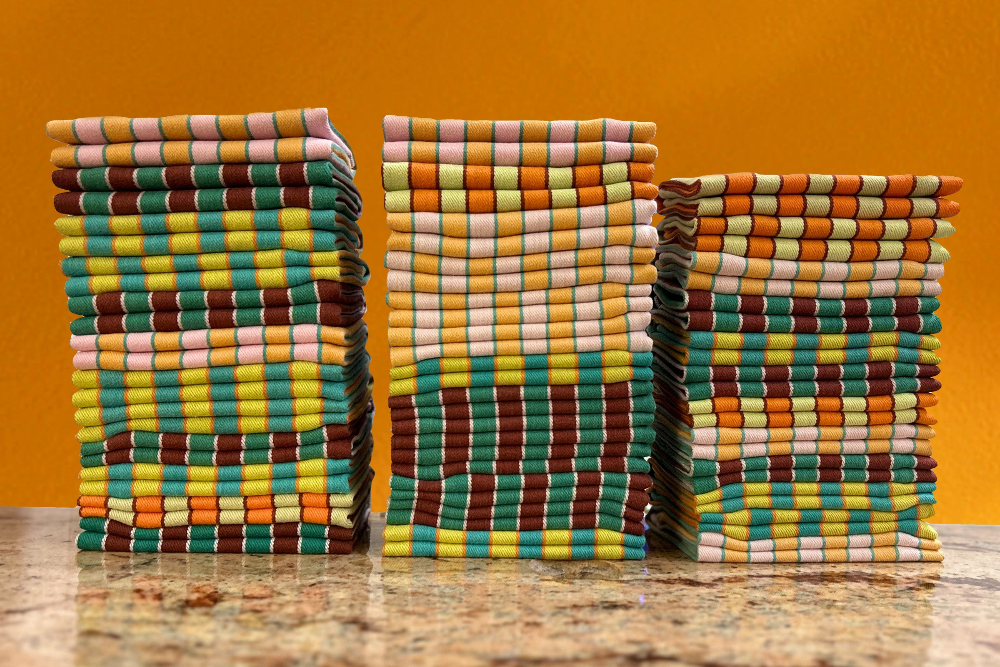 Stacks of colorful napkins neatly folded by Celsious