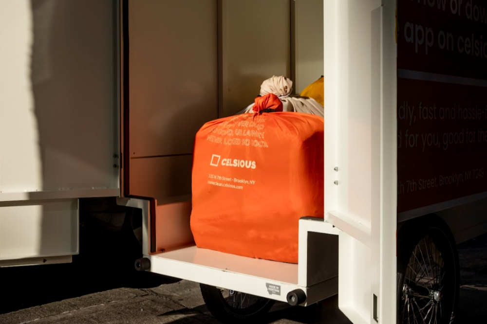 Knotted laundry bags in a Celsious e-bike, ready for delivery