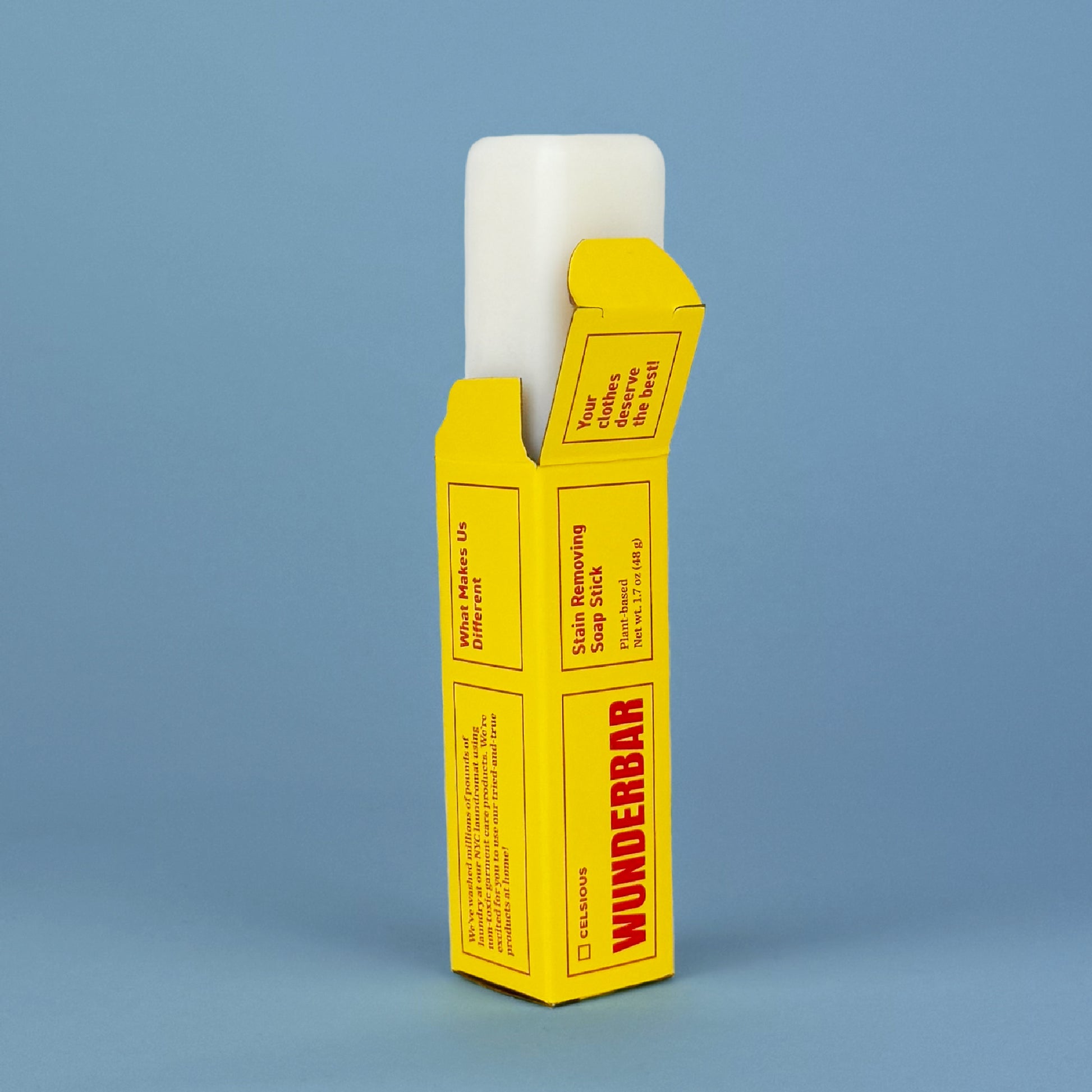 Wunderbar stain stick by Celsious in yellow packaging, with the product peeking out of the top