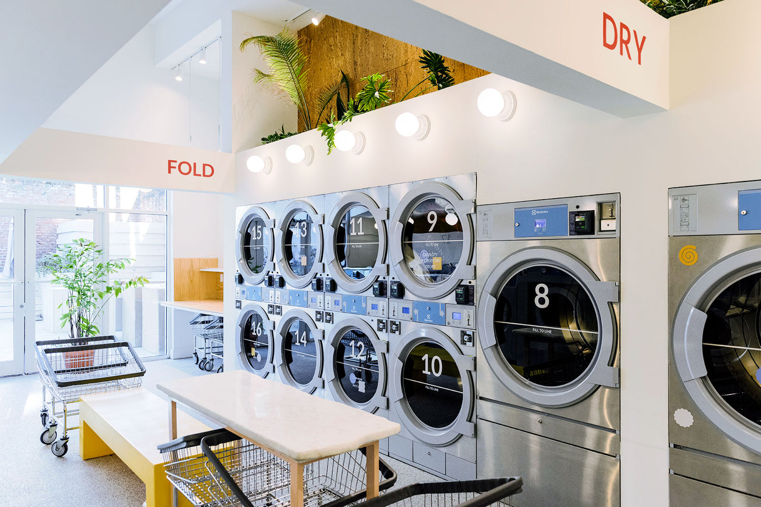 The light-filled modern interior of Celsious laundromat in Brooklyn
