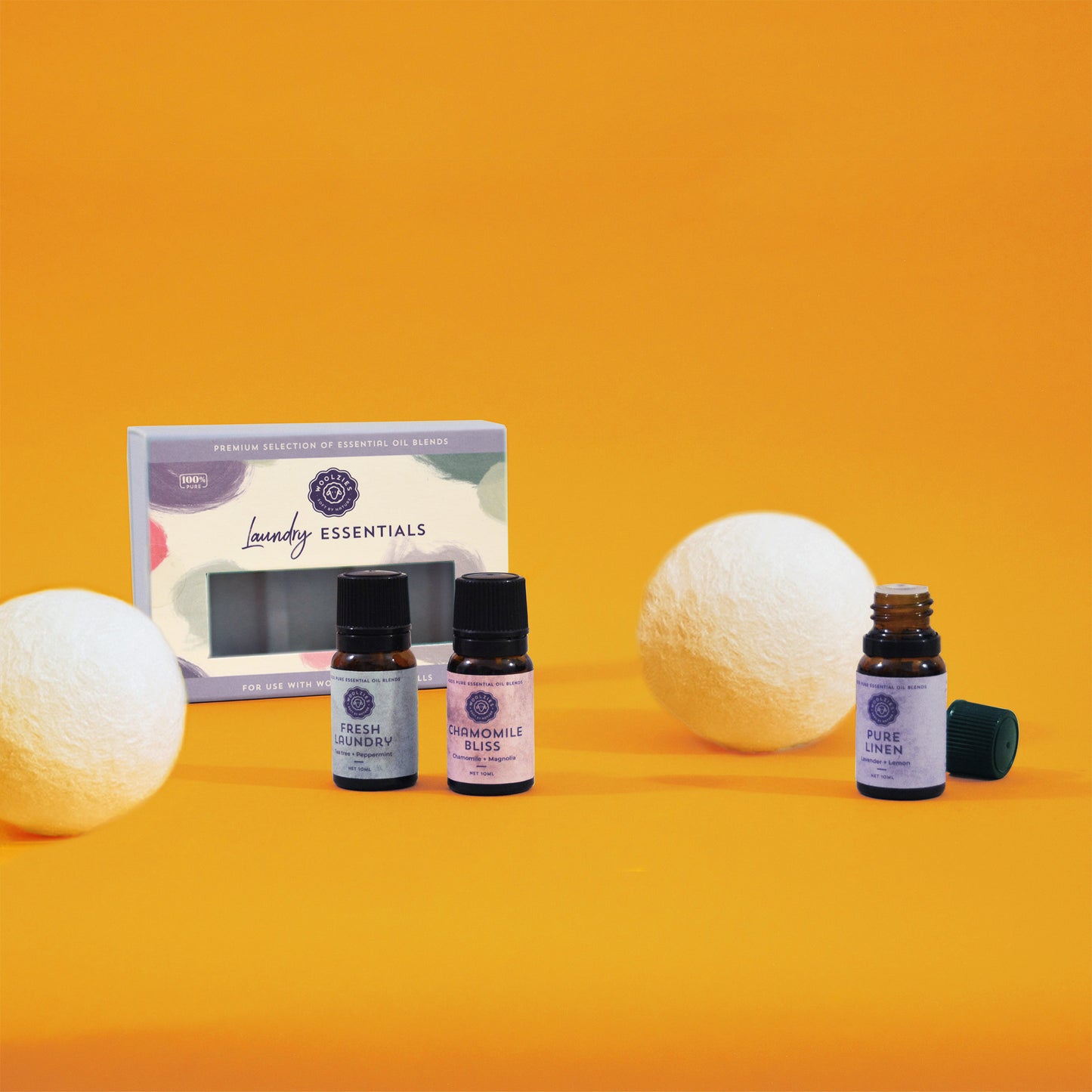 Woolzies essential oil blends for laundry with white wool dryer balls