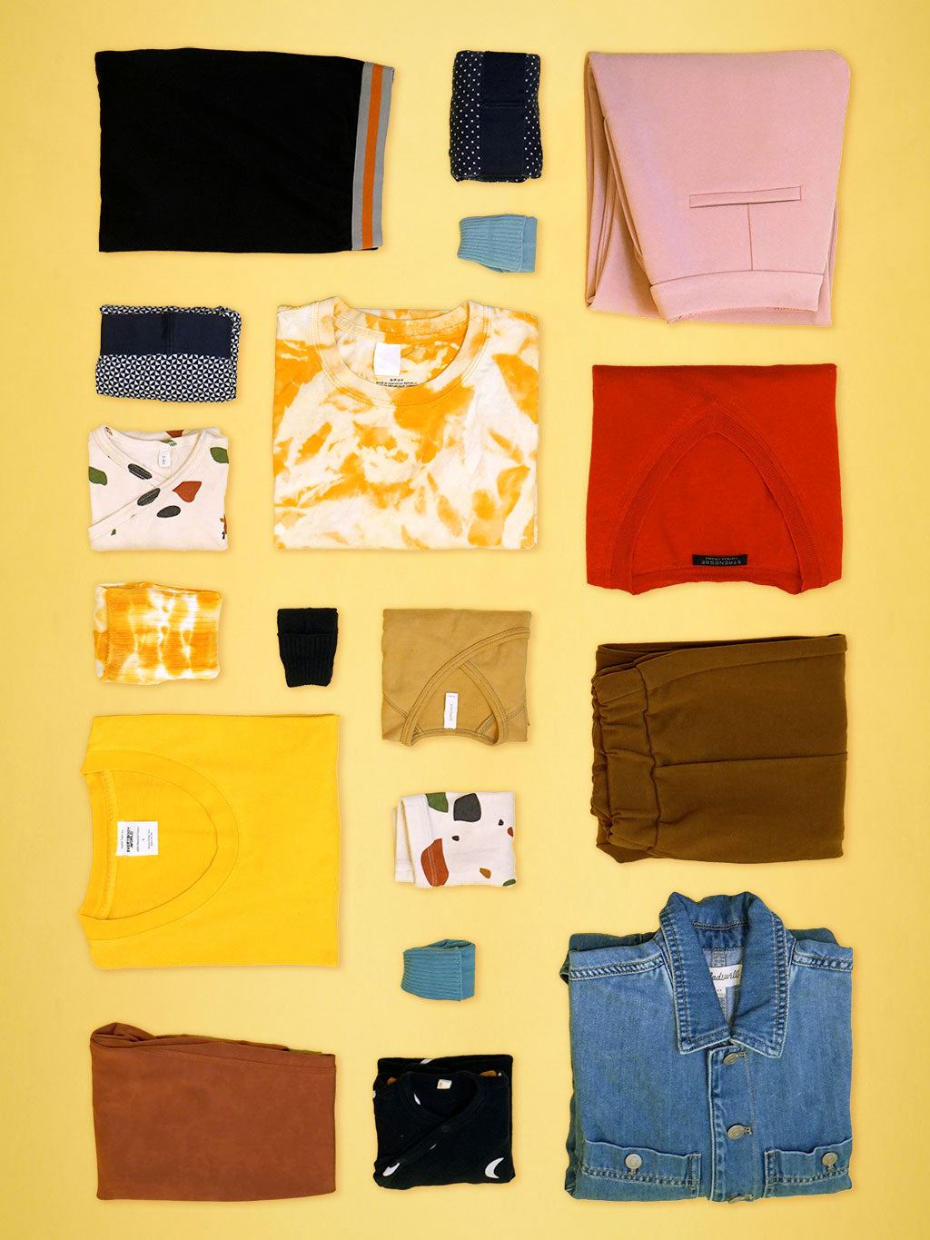 Immaculately folded clothing photographed from a birds-eye view