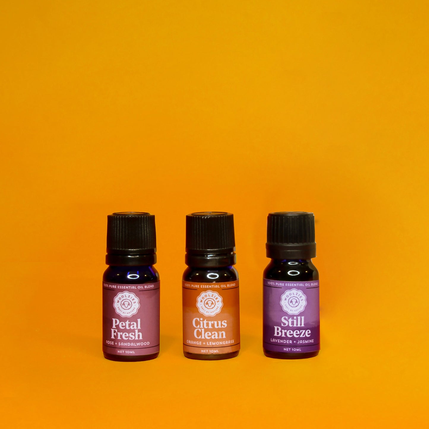 Woolzies essential oils for laundry labeled Petal Fresh, Citrus Clean and Still Breeze