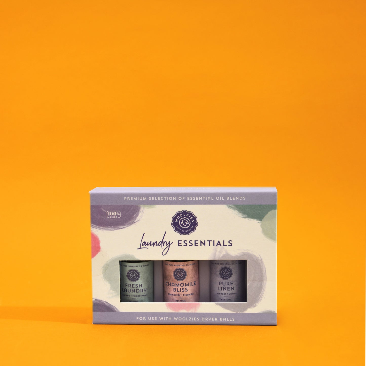 A box of essential oil blends by Woolzies labeled Fresh Laundry, Chamomile Bliss and Pure Linen