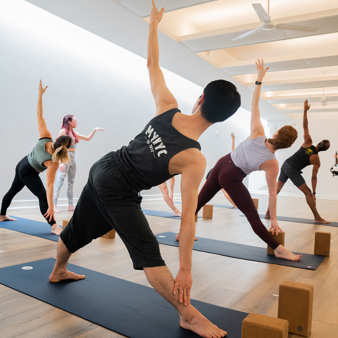 Hot yoga class at Modo Yoga NYC by Focus 4 Design Studio