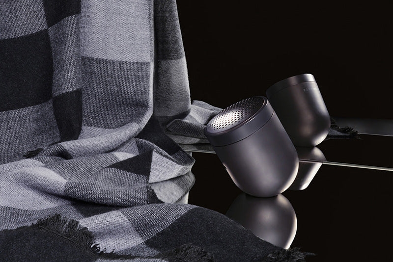 A sleek fabric shaver with a checkered scarf