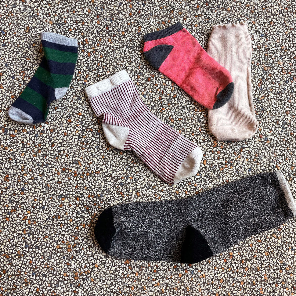 Five single socks missing their mates