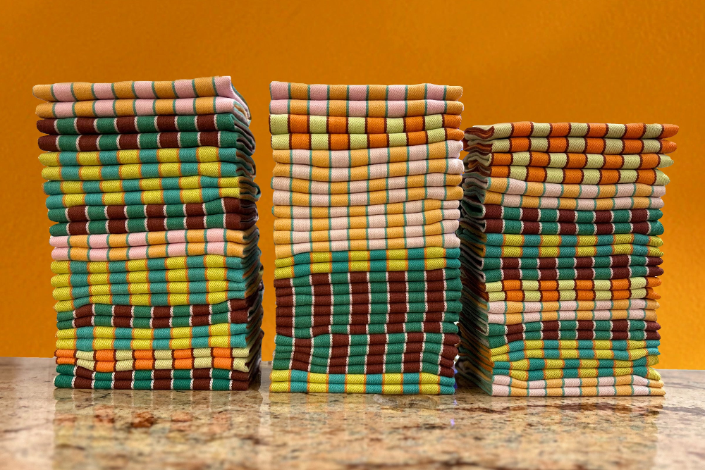 Neatly folded stacks of colorful dinner napkins