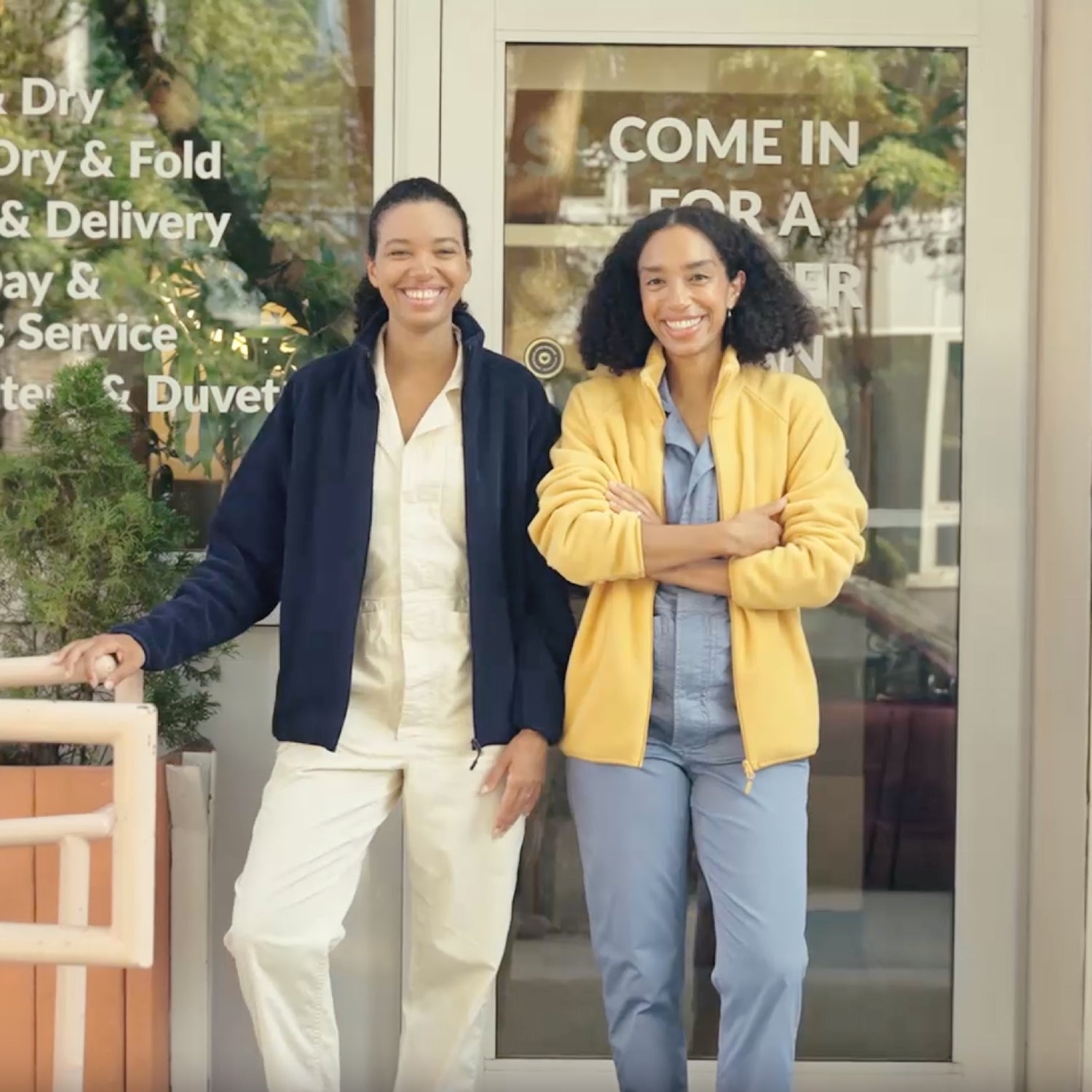 Theresa and Corinna Williams wear Uniqlo fleece at their laundry business