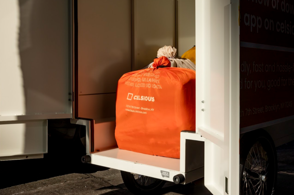 Knotted laundry bags in the back of a delivery cargo bike