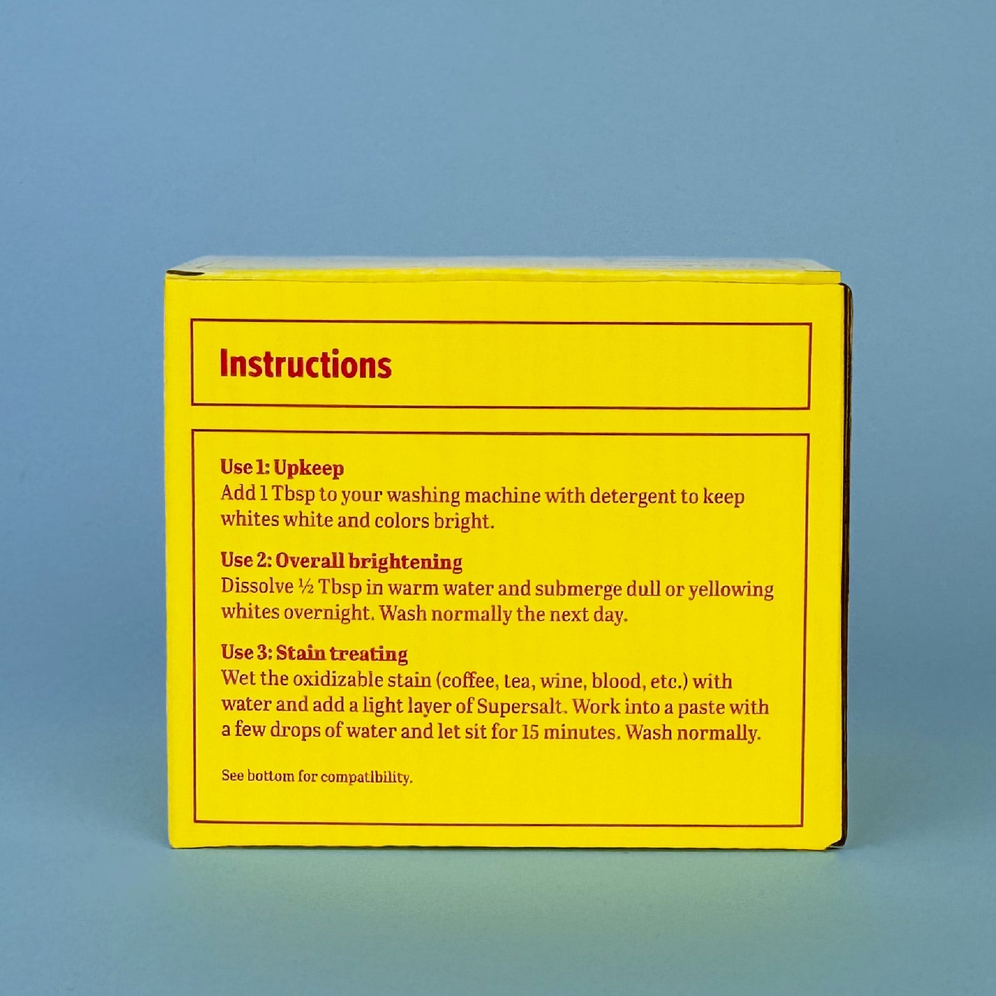 Supersalt laundry brightener in chic yellow packaging with red font, instruction side visible