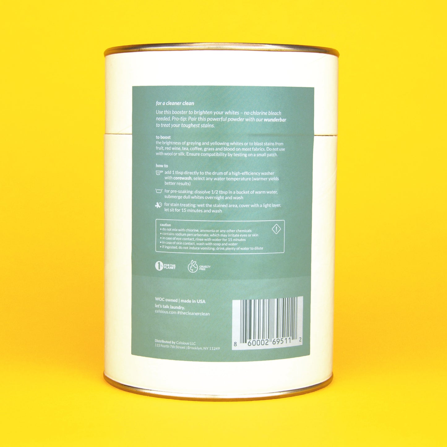 The back of a white canister of Supersalt oxygen booster with a seafoam green label and instructions, photographed on a yellow backdrop