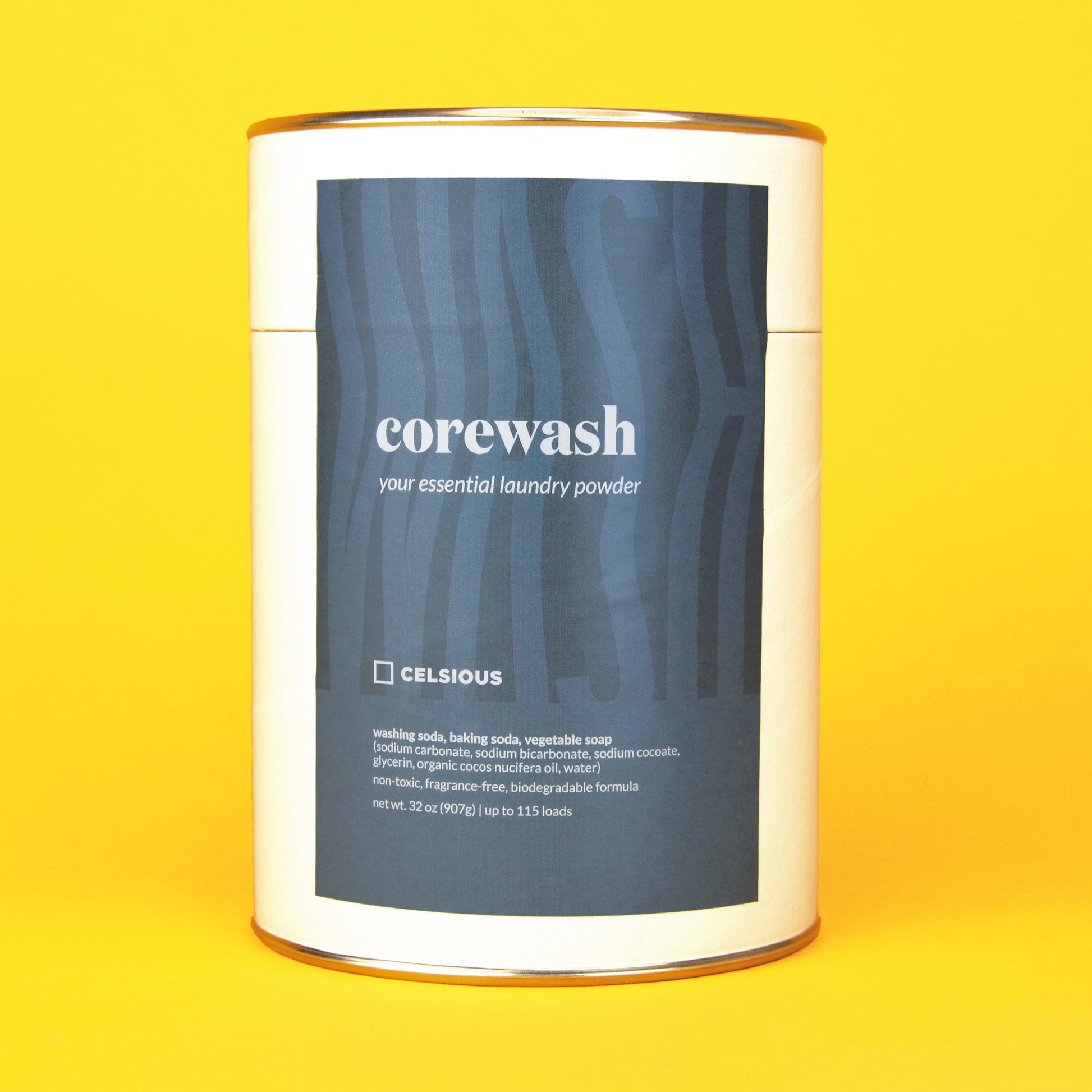 A white can of unscented laundry powder by Celsious with a blue label that reads "corewash" followed by ingredient info; the can is displayed on a yellow background
