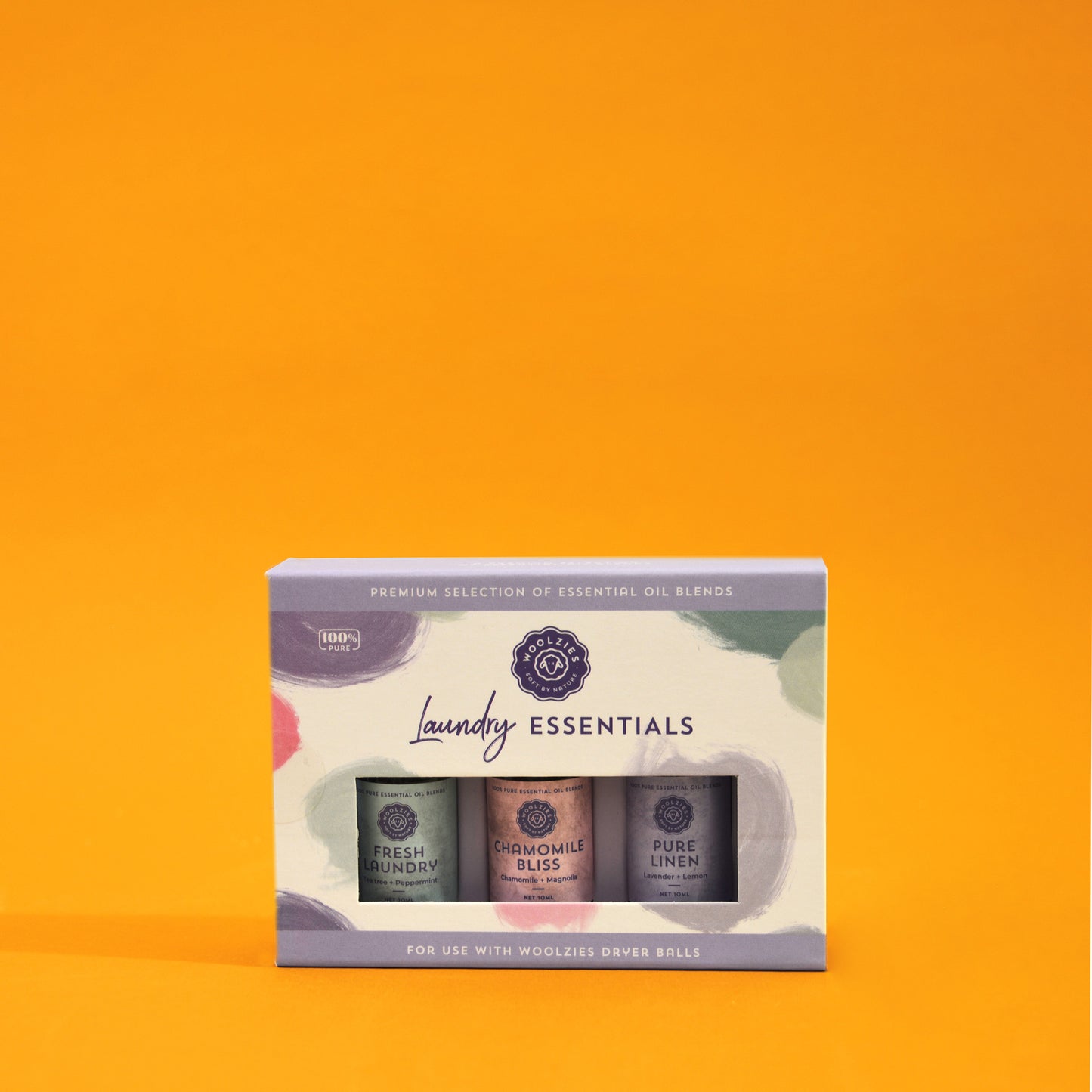 A box of three essential oil blends by Woolzies labeled Fresh Laundry, Chamomile Bliss and Pure Linen